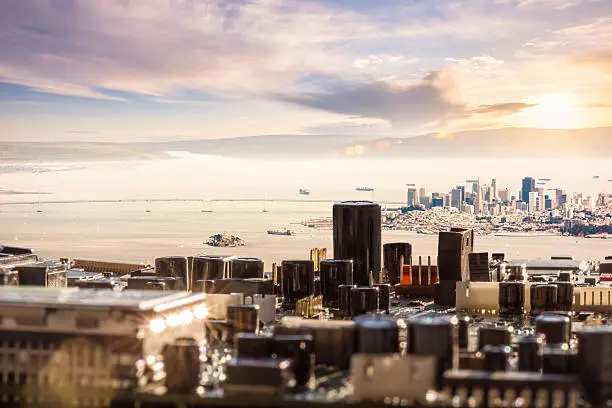 This image is a composite, where the foreground is created from circuit boards, the midground is the city of San Francisco, and the background and sky are from the Columbia River valley. This is a direct reference to the digital interconnectedness of modern civilization, especially in larger cities. It also highlights the architectural structure of computer circuit boards. The reference to Silicon Valley through the use of San Francisco is very intentional.