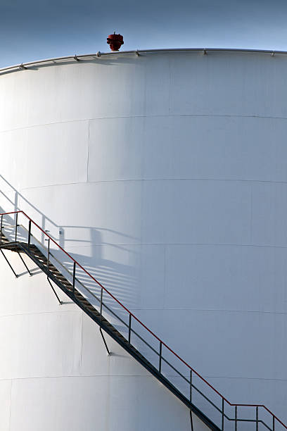istock white tanks in tank farm with blue sky 517953549