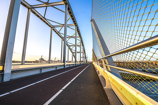 istock Construction of a steel bridge with a fence 517954327
