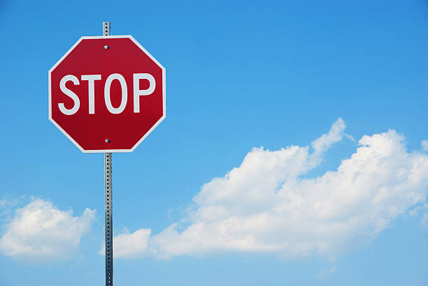 istock Stop sign for traffic against blue sky 517954345