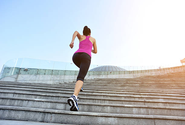 istock Runner athlete running on stairs. 517954759
