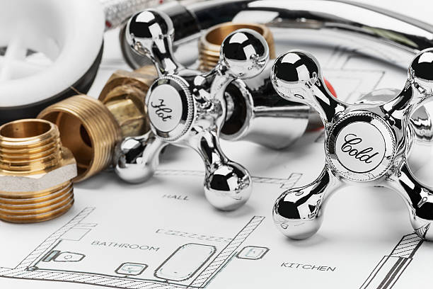 plumbing and tools lying on drawing for repair