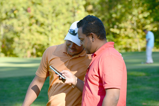 Business presentation and discussion during a game of golf.