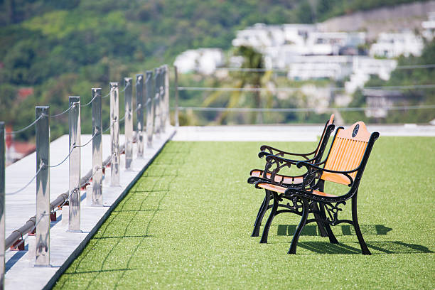 istock wooden chairs on the green grass 517961362