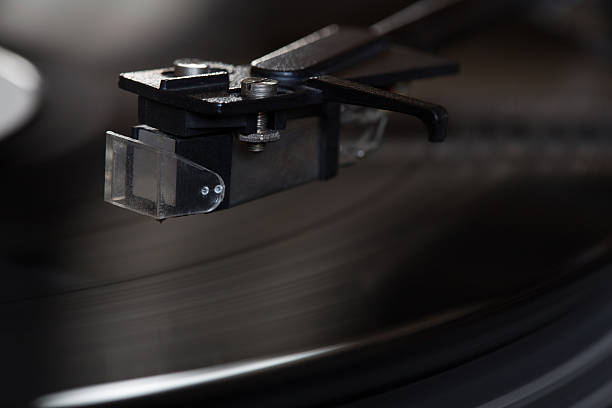 istock Vinyl player. The rotating disk. Head close-up. 517961894