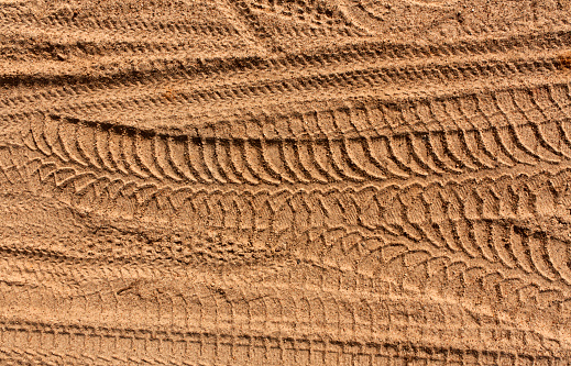 Tire tracks on sand. Background and texture.