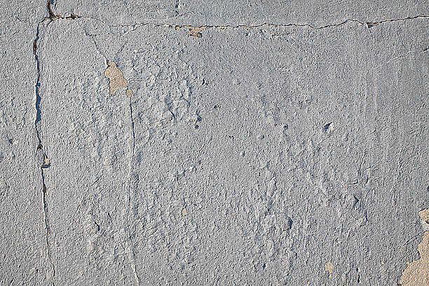 istock Peeling paint on wall with seam and grain texture. 517964880