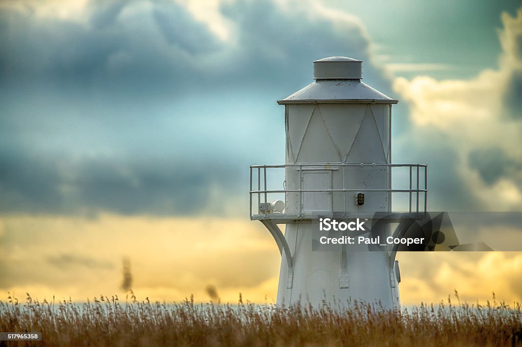 East Usk Lighthouse, Newport, Wales. East Usk Lighthouse, situated on the RSPB Reserve Newport Wetlands, is installed with a Dalen sun valve, and is maintained and operated by Trinity House, who are responsible for all lighthouses in the UK.  Tall grasses typical of the wetlands can be seen in the lower portion of the picture. Newport - Wales Stock Photo