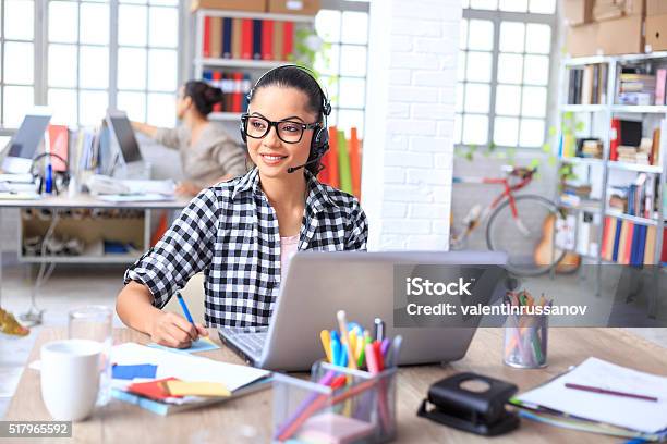 Smiling Call Center Operator At Work Stock Photo - Download Image Now - Adult, Answering, Asian and Indian Ethnicities