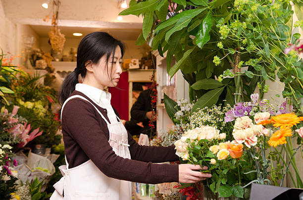 istock flower shop woman 517968896