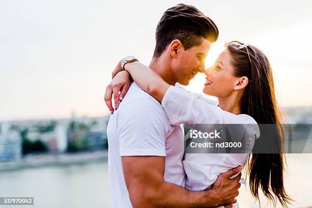 Young Beautiful Couple Hugging And About To Kiss Stock Photo - Download Image Now - Boyfriend, Embracing, Couple - Relationship