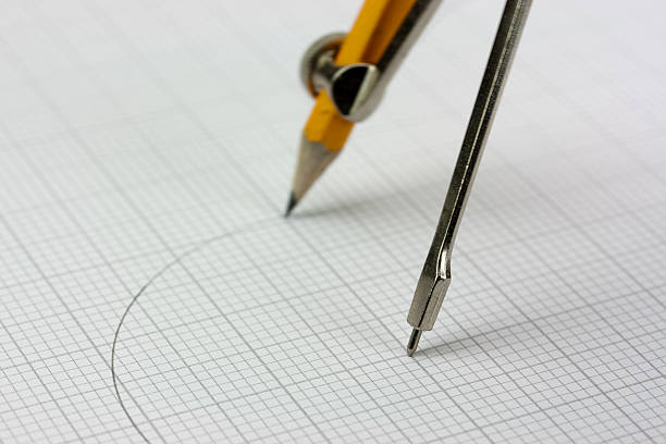 istock Close up of a compass on graph paper 517970044