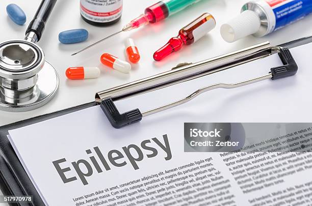 The Diagnosis Epilepsy Written On A Clipboard Stock Photo - Download Image Now - Epilepsy, Bottle, Capsule - Medicine