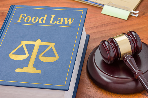 A law book with a gavel - Food law