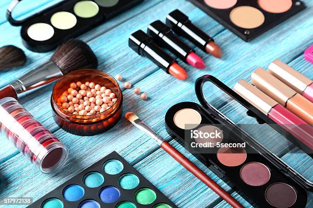 Makeup Brush And Cosmetics On Blue Wooden Table Stock Photo - Download Image Now - Artist's Palette, Arts Culture and Entertainment, Beauty