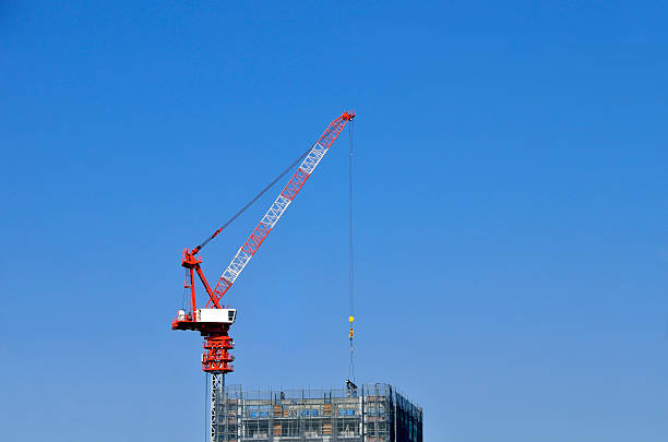 Tower cranes: Luffing jib tower cranes Tower cranes: Luffing jib tower cranes jib stock pictures, royalty-free photos & images