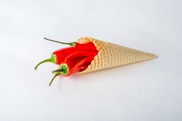 istock Red hot chili peppers in a wafer cone 517973234