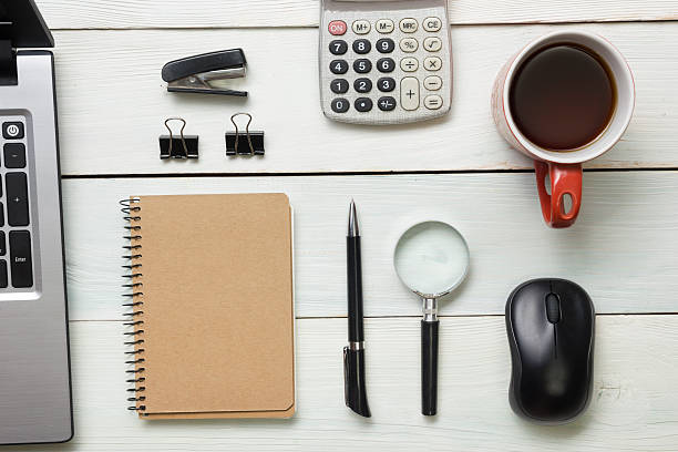 istock Office desk table with supplies and coffee cup. Top view 517973598