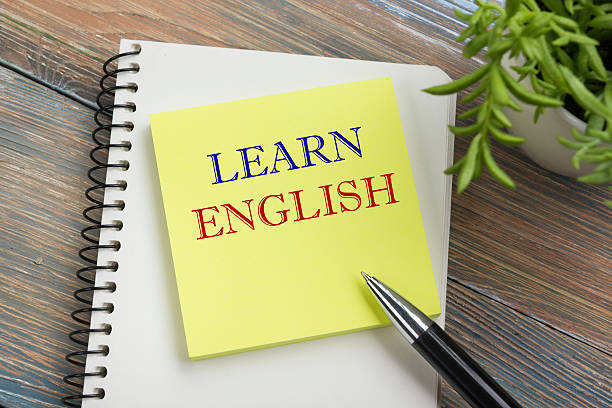 istock Learn English Text written on notebook page, red pencil and 517974290