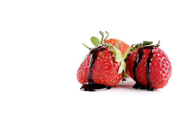 istock Strawberry in chocolate isolated on a white 517975292