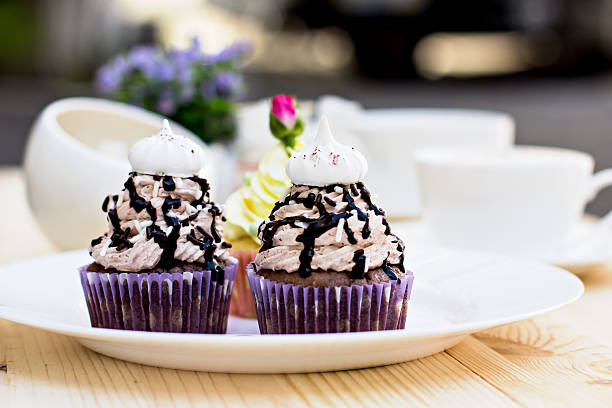 istock Chocolate Cupcake with chocolate frosting on the table 517975400