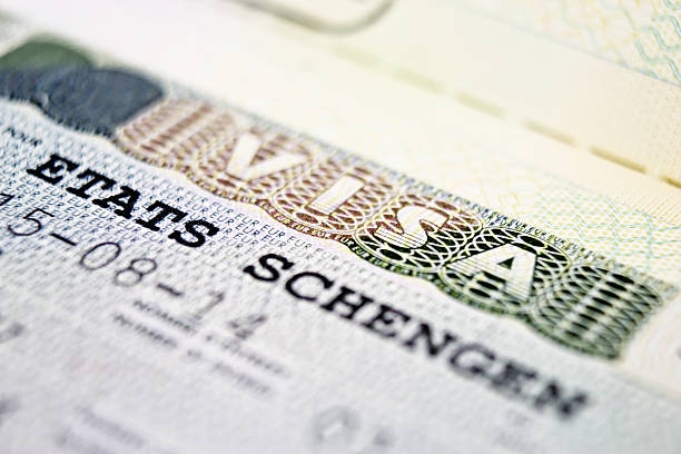 istock Close up Schengen visa in the passport 517976352