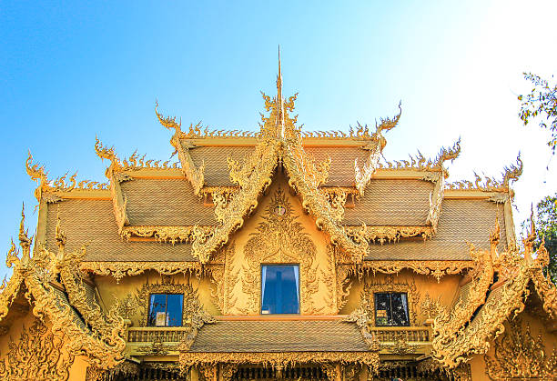 istock Public golden temple with blue sky background 517988384