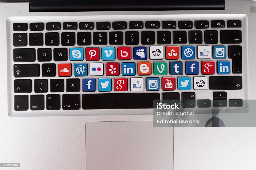 Social Media Logos on Macbook Keyboard Sakarya, Turkey - October 1, 2014: Social Network Brands Logos Placed on Computer Keyboard Reddit Stock Photo