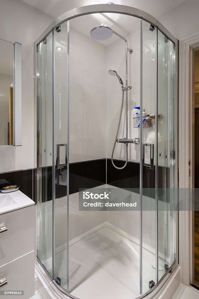 Corner Shower Cubicle A modern quadrant shower enclosure with sliding doors Shower Stock Photo