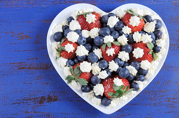 istock Patriotic red, white and blue berries with fresh whipped cream 517993641