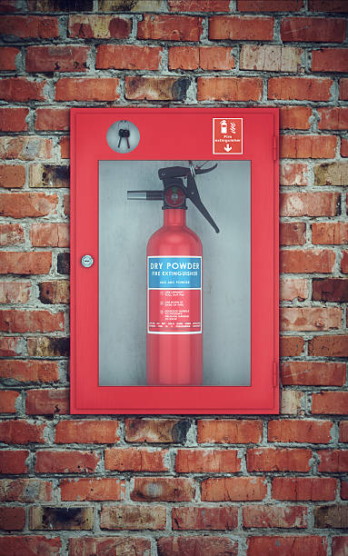 Fire extinguisher in wall box. brick wall stock photo