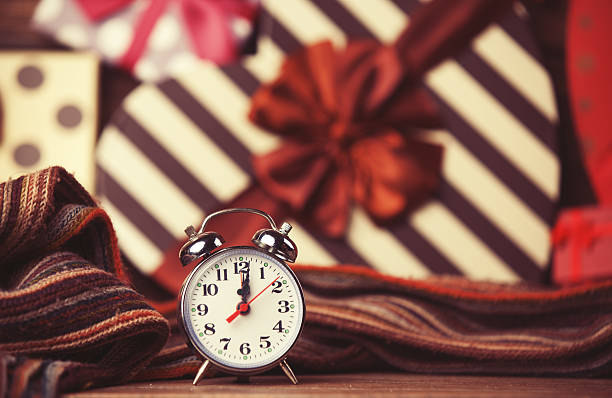 istock Vintage clock on christmas background 517994637