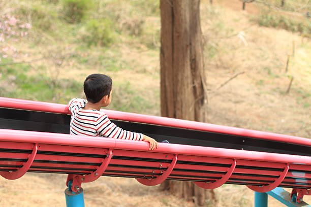 istock Japanese boy on the slide (6 years old) 517995038