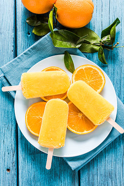 istock natural juice orange popsicle, from above 517995722