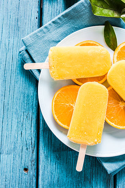 istock Healthy snack, orange natural popsicle 517995902