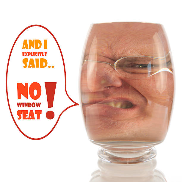 Angry face locked up in glass with comment