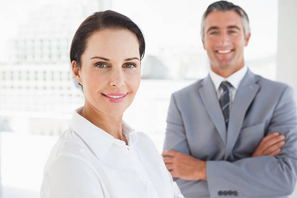 istock Smiling business woman at work 517997611