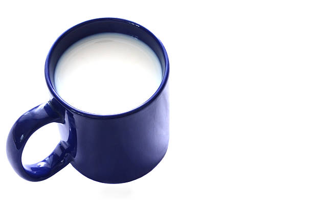istock Blue cup of milk isolated on white background 517997678
