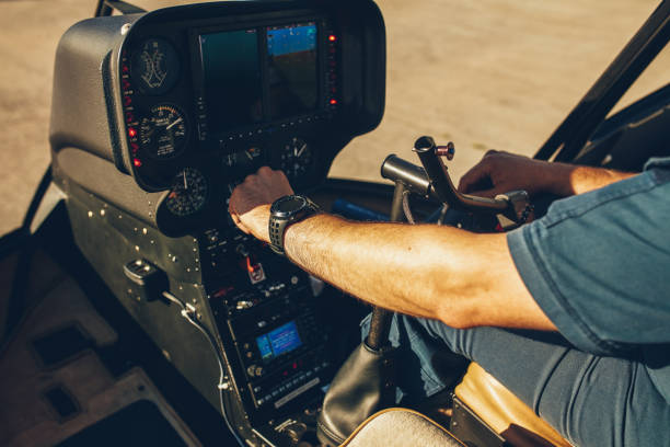 istock Pilot's hand on an helicopter instrument panel. 517997756