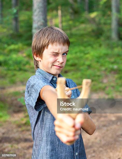 Kid With Slingshot Stock Photo - Download Image Now - Accuracy, Activity, Aiming