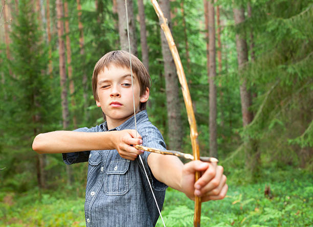 istock Kid with homemade bow and arrow 517997961