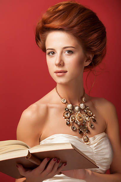 istock edwardian women with necklace and book 517998003