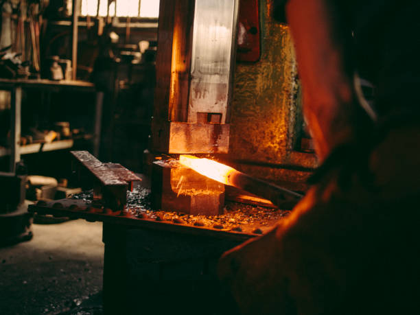 istock Hammering and forging the iron in blacksmith shop 517998280