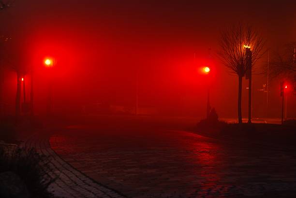 Town night Foggy street with red lights red light stock pictures, royalty-free photos & images
