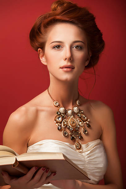 edwardian women with necklace and book