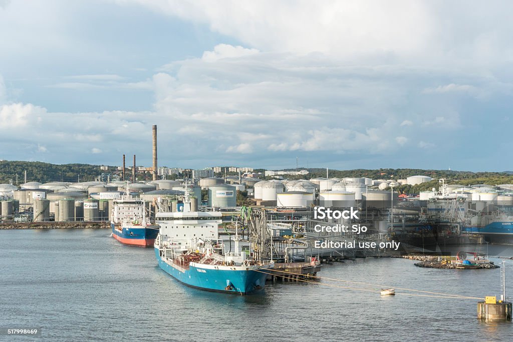 Oil tankers in a harbor Gotherburg, Sweden - August 24, 2014: Moored oil tankers unloading oil at an oil terminal in the harbor of Gothenborg in Sweden. Oil Tanker Ship Stock Photo