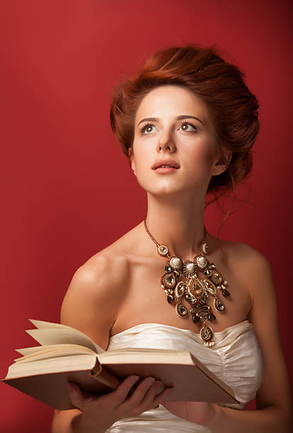 istock edwardian women with necklace and book 517998695