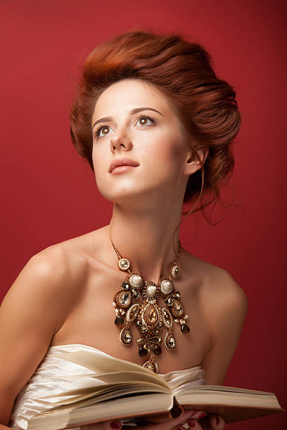 istock edwardian women with necklace and book 517999023