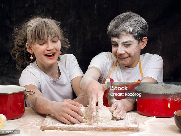 Teens Knead The Dough Stock Photo - Download Image Now - Adolescence, Baking, Bonding