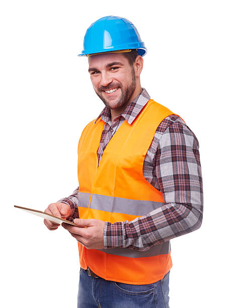 arbeiter in helm mit einem blauen digitaltablett - smiling single object photography orange stock-fotos und bilder